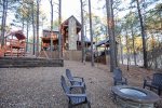 Backyard view with fire pit and play set